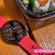 The Huawei Watch 3 on a wooden table near sushi